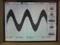 1kHz Sine Wave, low level performance. High frequency switching residual breakthrough causes the wave to appear extremely furry. Note the scope thinks the waveform is 20kHz despite the horizontal scale - it cannot get a lock on the frequency due to the excessive out of band noise.