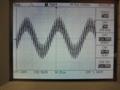 10kHz sine wave, low level. Switching residual rides over the waveform.