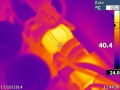 Thermal closeup of the mains input section. The common-mode filter choke is running hot - it's unusual to find these fitted to toroidal amplifiers.