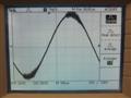 Oscillation on top and bottom of waveform. Full power, 1kHz. The vertical scale on the oscilloscope screen is half the actual output voltage because of the differential oscilloscope probe used.