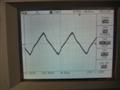 10kHz triangle wave, 8R, threshold of clipping. Visible distortion due to underdamped output filter.