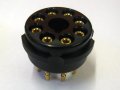 The New black bakelite valve bases from Hifi Collective. The gold plated turned pin multi fingered construction gives far superior contact integrity to the valve pin. Note the lack of fixing flange - the base is supplied with a removable fixing bracket, but in this case there was no mating surface in the amplifiers for the base to be held aginst. They would have 'fallen' through the chassis holes